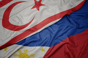 waving colorful flag of philippines and national flag of northern cyprus.