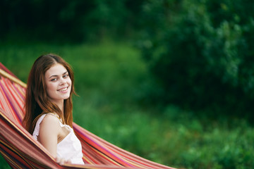 portrait of smiling woman with long hair and clear skin