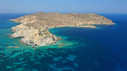 Aerial drone photo of secluded paradise beach of Gramvousa in small island of Gramvousa near Kalotaritissa with emerald clear sea, Amorgos island, Cyclades, Greece