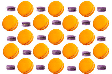 Yellow and  violet french macaroons falling or flying in motion on white background.