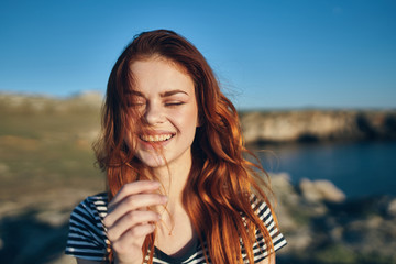 portrait of young woman on background of blue sky