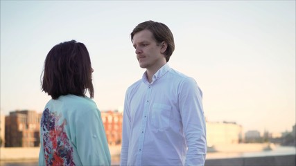 couple dancing on the shore. Young couple dancing on the promenade