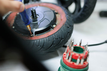 electric motor repair electric scooter wheel. Eco-friendly electric vehicle repair service