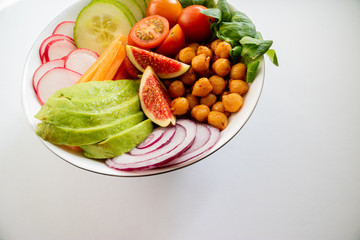 Isolated Buddha bowl made with fresh and seasonal ingredients.