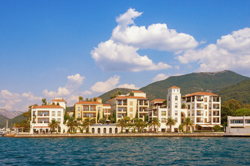 Beautiful view of embankment of Tivat city from sea on sunny summer day. Montenegro, Adriatic Sea