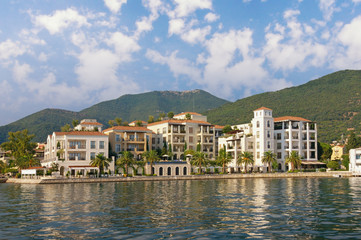 Montenegro. Beautiful view of embankment of Tivat city from the sea on sunny summer day