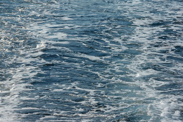 Obraz premium Wave pattern on the water surface of behind boat, background. Adriatic Sea