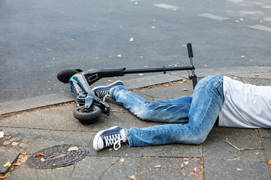 Unconscious Man Lying On Street After Accident Electric Scooter