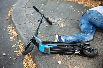 Unconscious Man Lying On Street After Accident Electric Scooter © Andrey Popov
