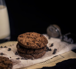 Stack of chocolat chip cookies with milk for breakfast