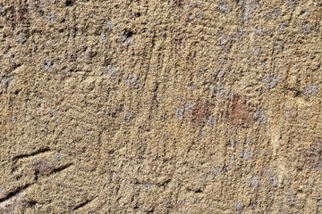 Detailed view of aged concrete walls with cracks and a lot of structure in high resolution