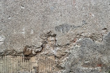 Detailed view of aged concrete walls with cracks and a lot of structure in high resolution