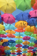 Fototapeta na wymiar Covered by colorful umbrellas