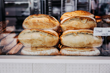 Assorted bread store display, indoor of french bakery.