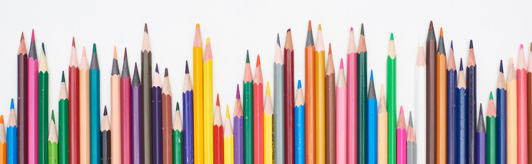 Panoramic shot of color sharpened pencils isolated on white