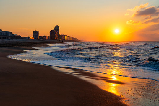 Ostend (Oostende) city beach at sunset by the North Sea, Belgium.