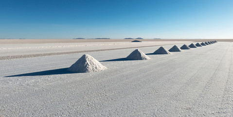 Panorama of salt pyramids in the salt industry town of Colchani located in the Uyuni salt flat or...