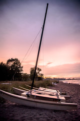 sail boat on beach at dusk