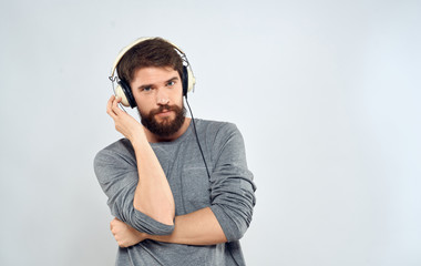 young man listening to music with headphones