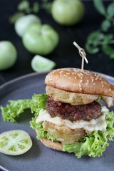 burger with fried green tomato.  american cuisine. Unripe Tomatoes Fried In A Sandwich.