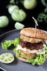 burger with fried green tomato.  american cuisine. Unripe Tomatoes Fried In A Sandwich.
