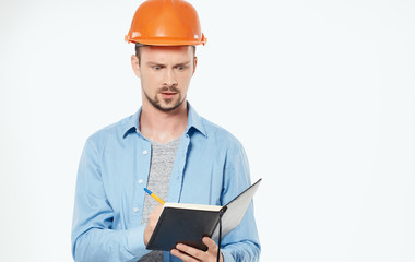 young architect with blueprints