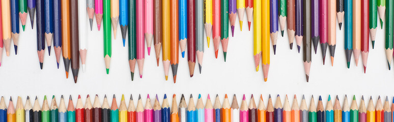 Panoramic shot of rows of sharpened color pencils