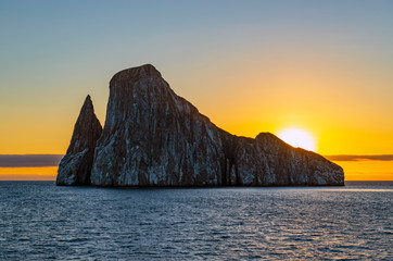 The magic silhouette of Kicker Rock (Leon Dormido) by the coast of San Cristobal island inside the...