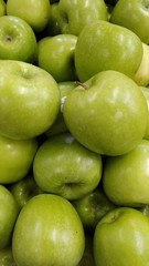 Fototapeta na wymiar green apples on black background