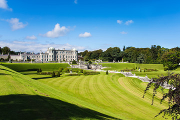 Tourists visiting Powerscourt Gardens one of the most beautiful gardens in Ireland view on mansion from terraced lawn © Dawid