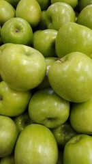 Fototapeta na wymiar green apples on black background