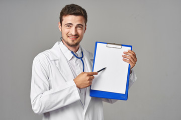 young doctor with clipboard