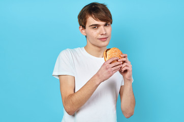 young man with hamburger