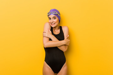 Young swimmer caucasian woman going cold due to low temperature or a sickness.