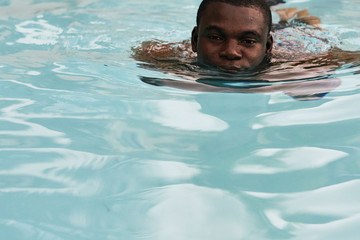 man swimming in the pool