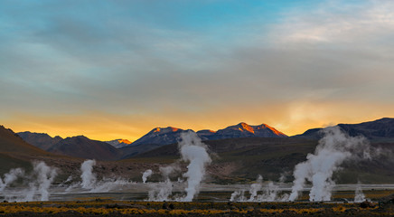 The geysers of the El Tatio geyser field, the highest in the world at 4320m altitude, at sunrise in the region of San Pedro de Atacama and the Atacama desert, Chile.