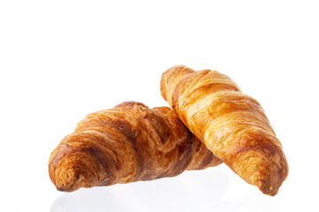 Two classic french croissant on a white background. Homemade baking.