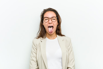 Young european business woman funny and friendly sticking out her tongue.