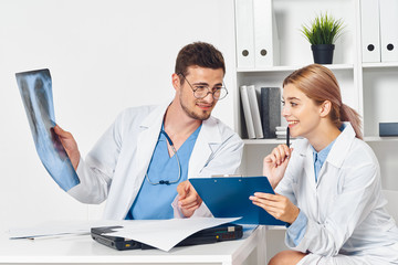 portrait of doctor and patient in office