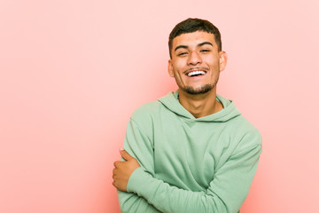 Fototapeta premium Young hispanic sport man laughing and having fun.