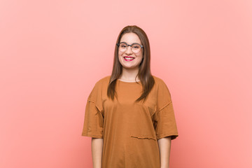 Fototapeta premium Young student woman wearing eyeglasses happy, smiling and cheerful.