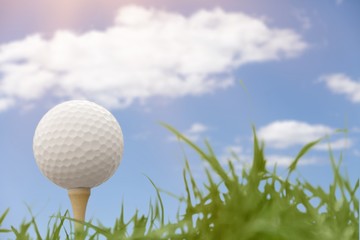 Golf ball on tee on golf course
