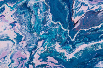 Fluid Art. Abstract colorful background, wallpaper. Mixing paints. Modern art. Marble texture