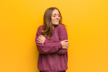 Young casual woman giving a hug