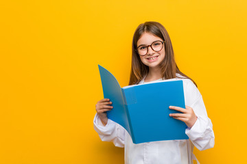 Little caucasian girl wearing a doctor costume