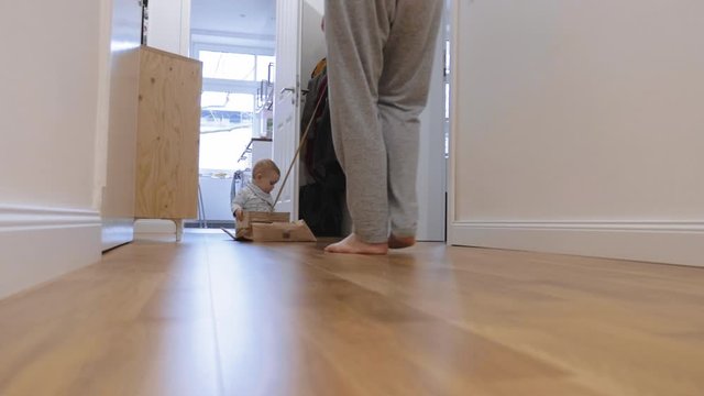 Baby Sliding in Cardboard Box with Mom Pulling String