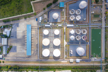 Aerial view of Chemical industry storage tank and tanker truck In wailting in Industrial Plant to tranfer oil to gas station.