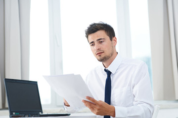 Fototapeta premium businessman working on his laptop in office