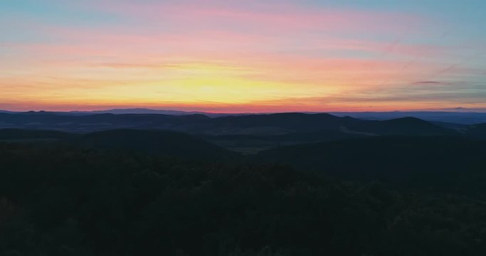 Drone view of the North Hungarian landscape of the Muzsla, part of Matra. Hills and fields of agricultural view with roads in the distance view.  Hungarian town Paszto. View from the peak named Tepke.