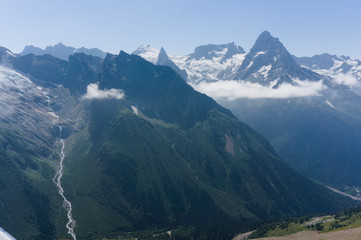 Northern great caucasus mountains near dombay with glaciers and snow in august 2019, original raw picture